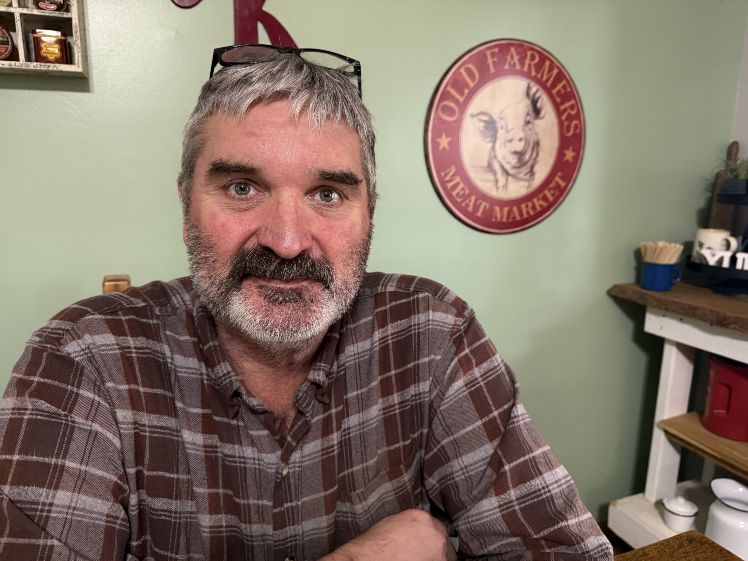 Eric Kerska seated in his home in Rochester.